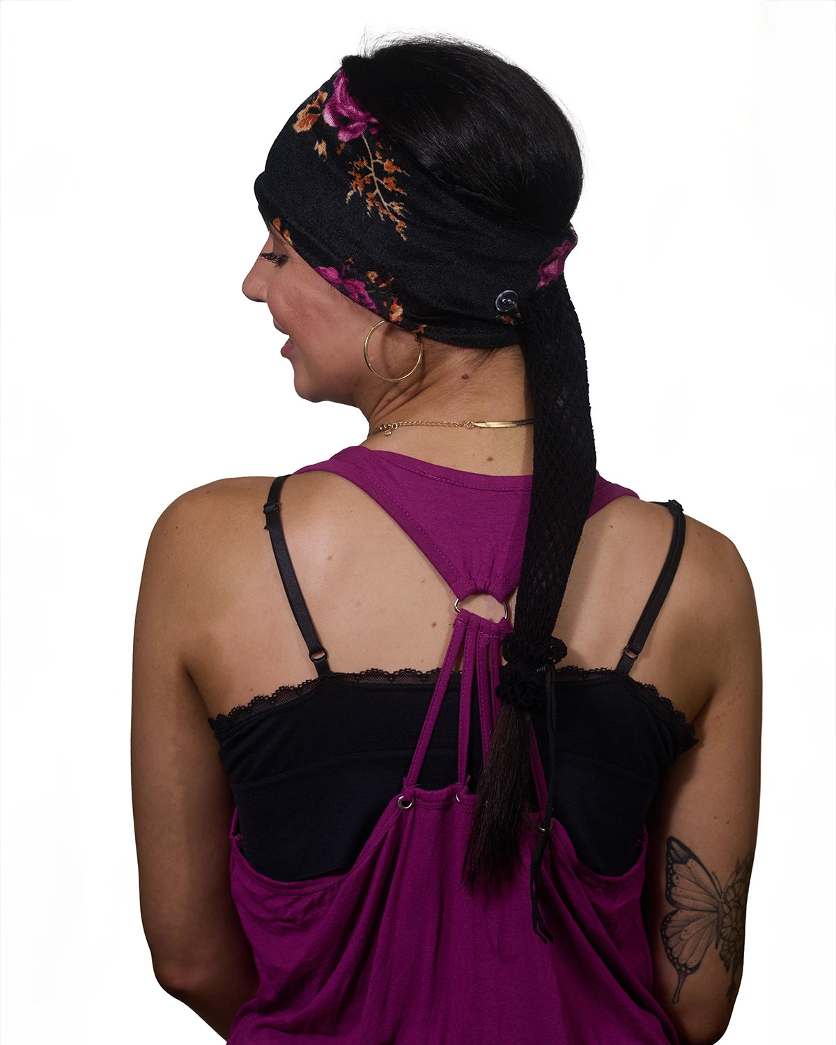 Black Floral wide headband with ponytail protector, back view on female model.
