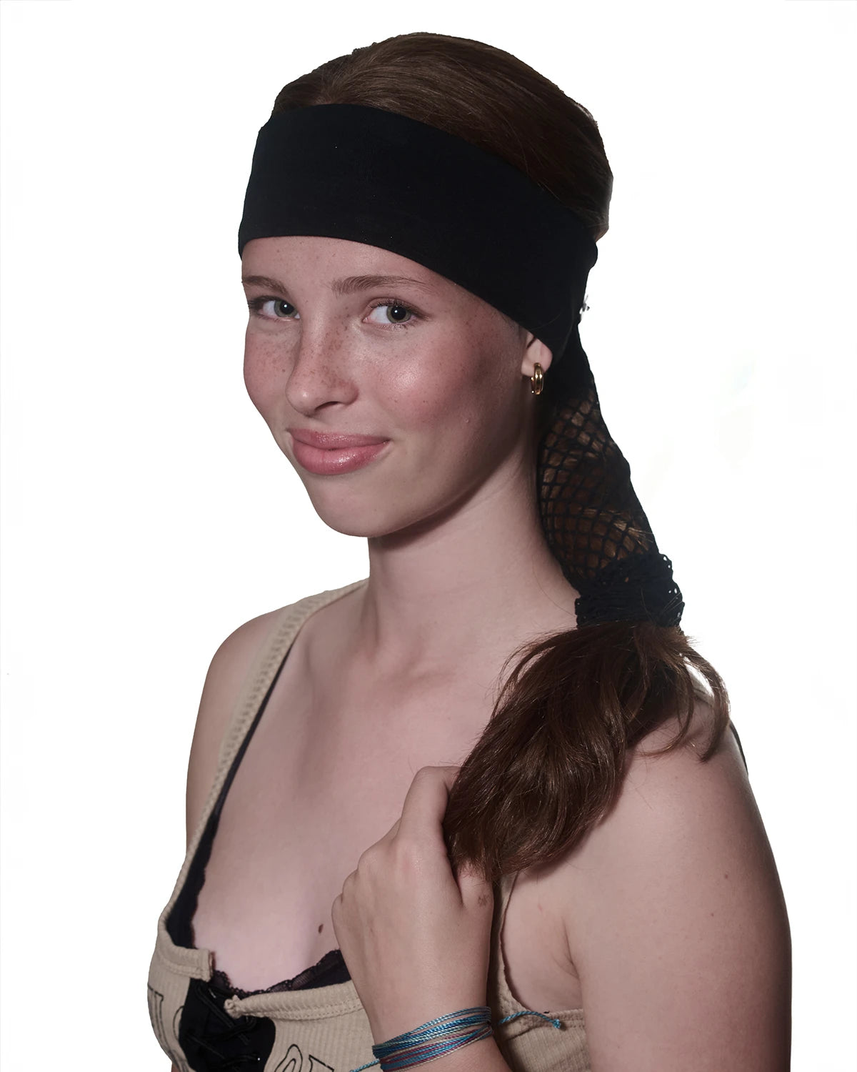 Tiger print headband with ponytail protector, reverse view on female model.