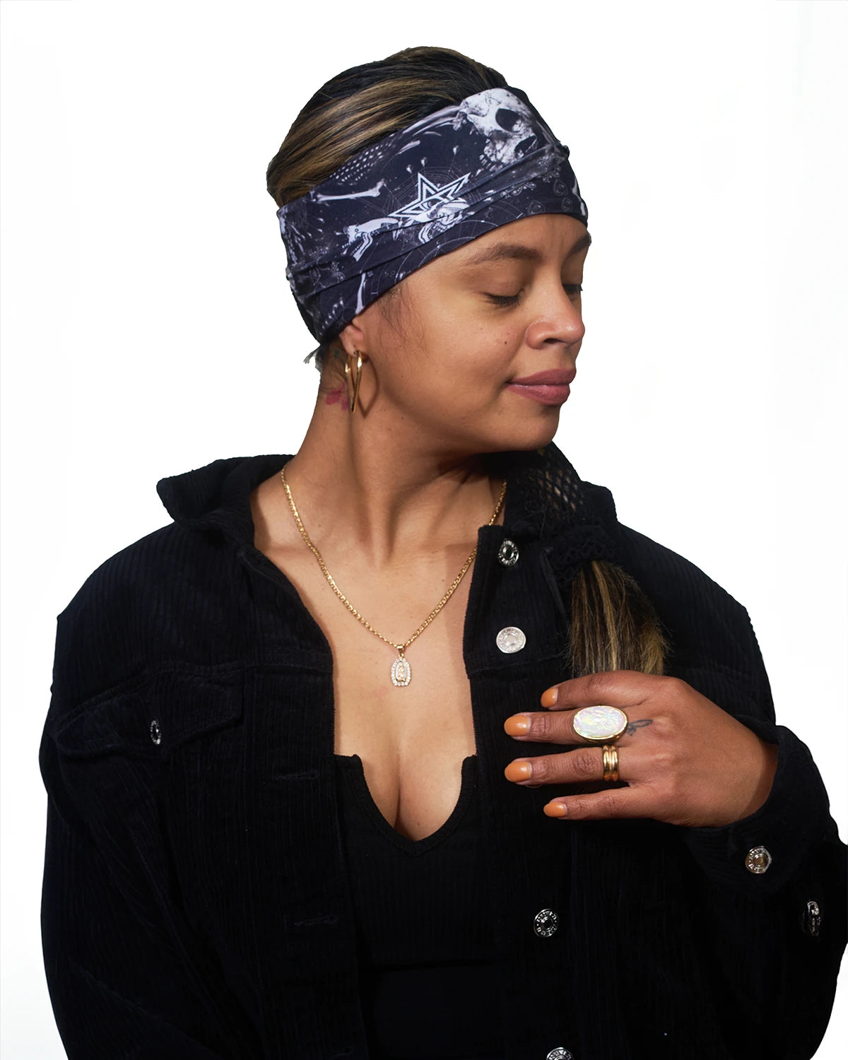 Black Skulls wide headband with ponytail protector, side view on female model.