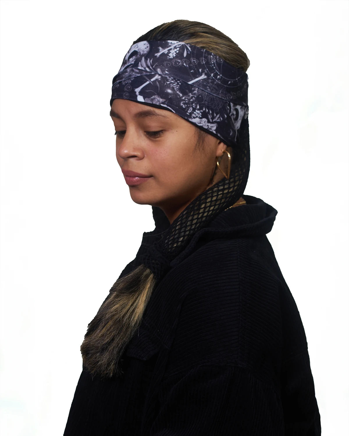 Black Skulls wide headband with ponytail protector, side view on female model.