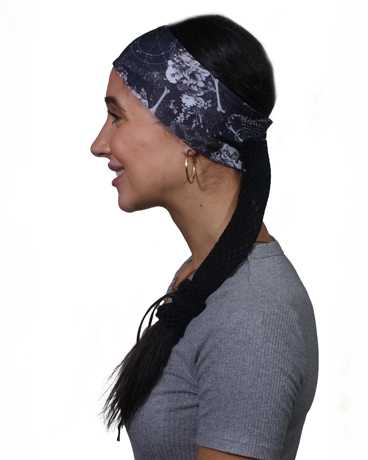 Black Skulls headband with ponytail protector, side view on female model.