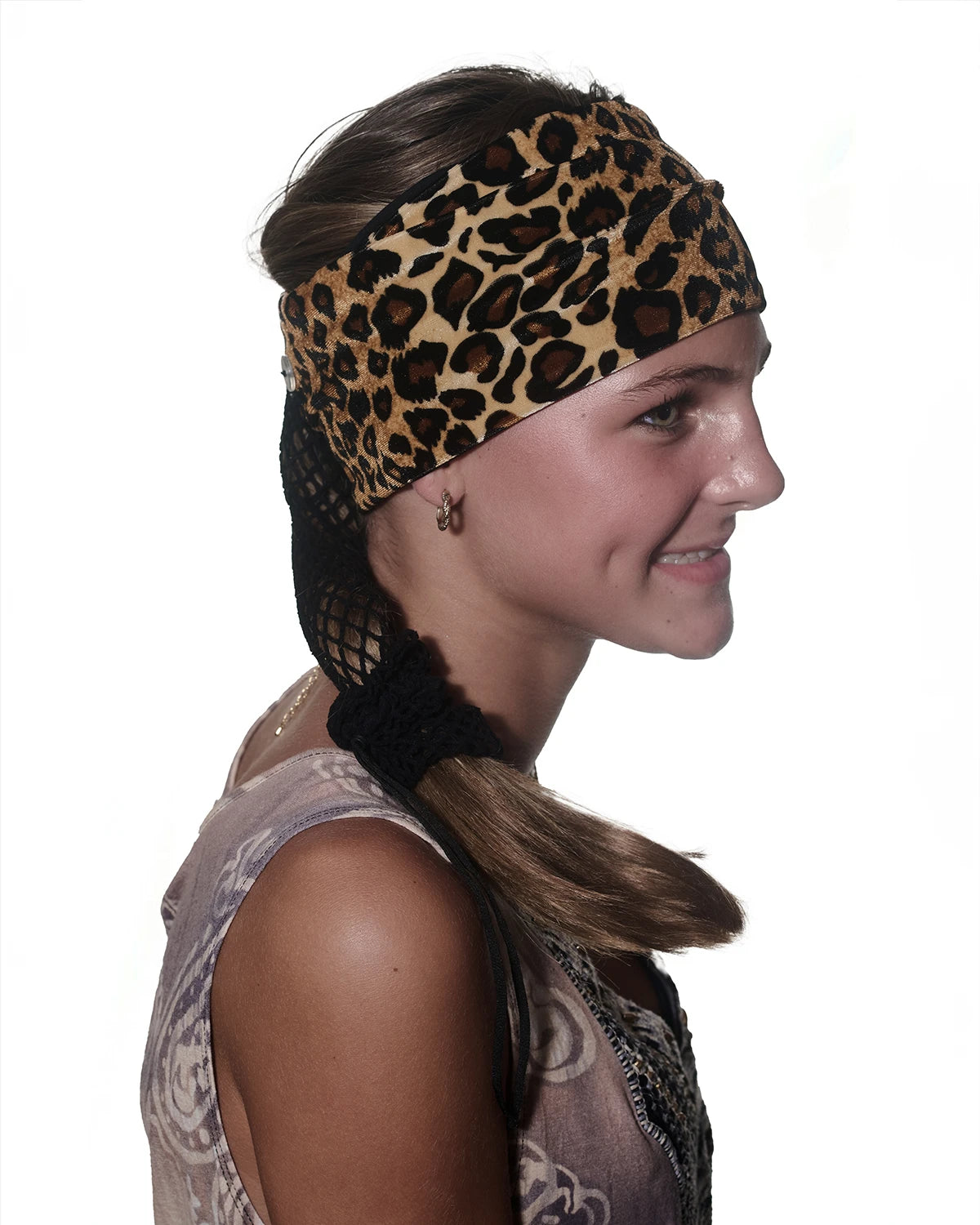 Cheetah print Wide headband with ponytail protector, side view on female model.