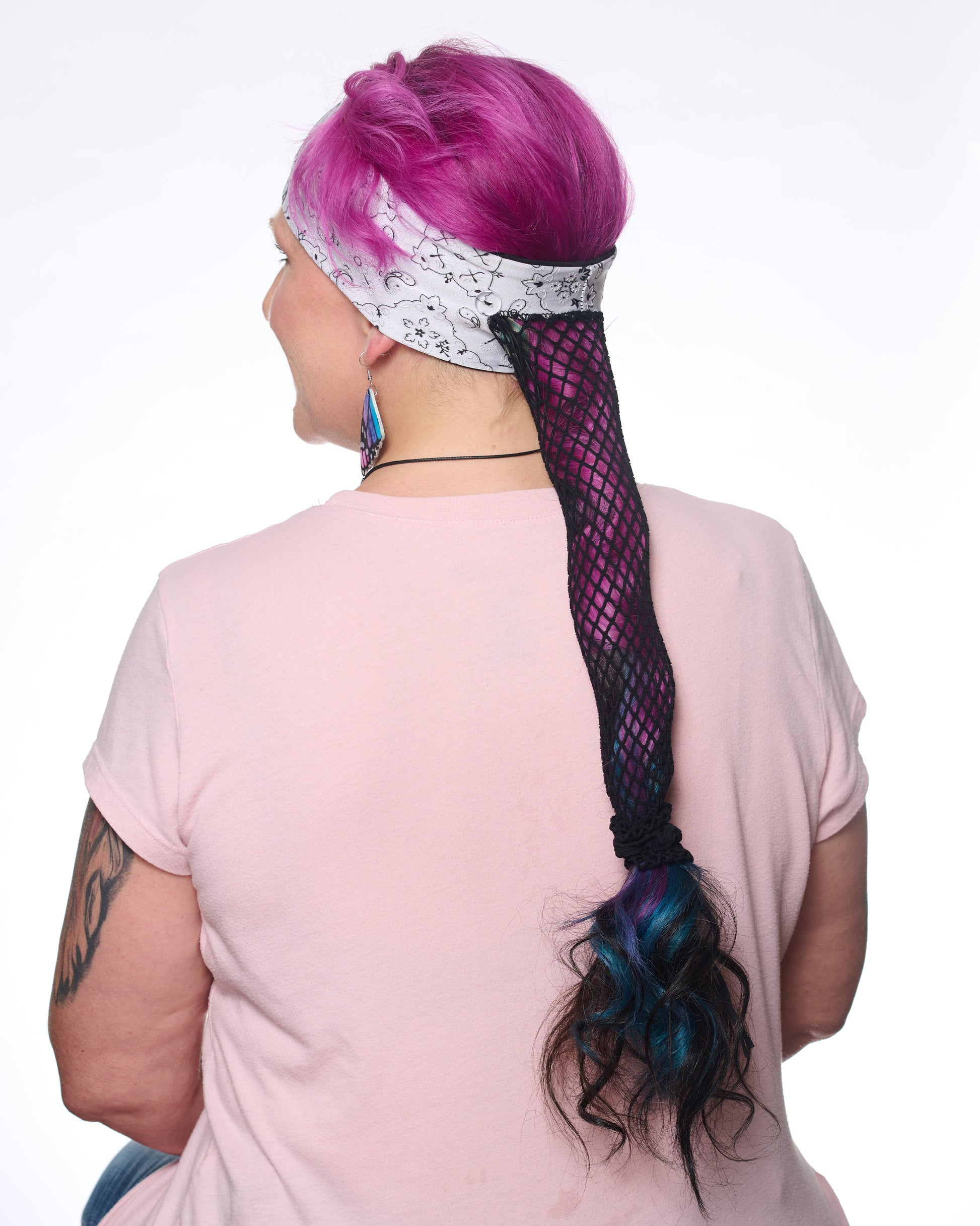White and Black Elegance Bandana headband with ponytail protector, back view on female model.