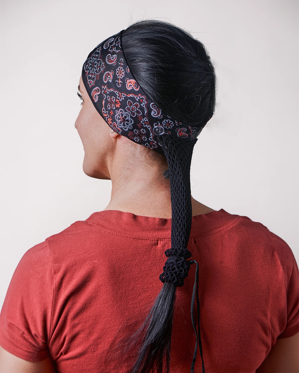 Racy Black and Red Bandana headband with ponytail protector, back view on female model.
