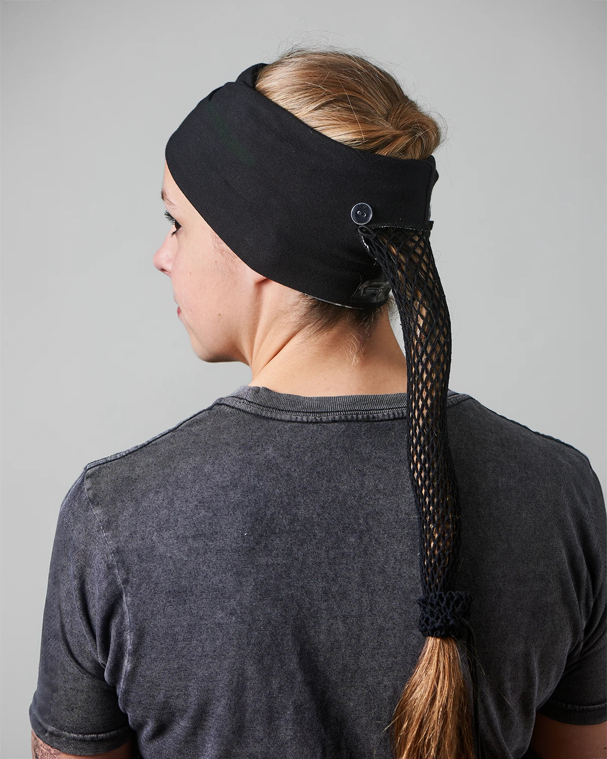Black Floral wide headband with ponytail protector, reverse back view on female model.