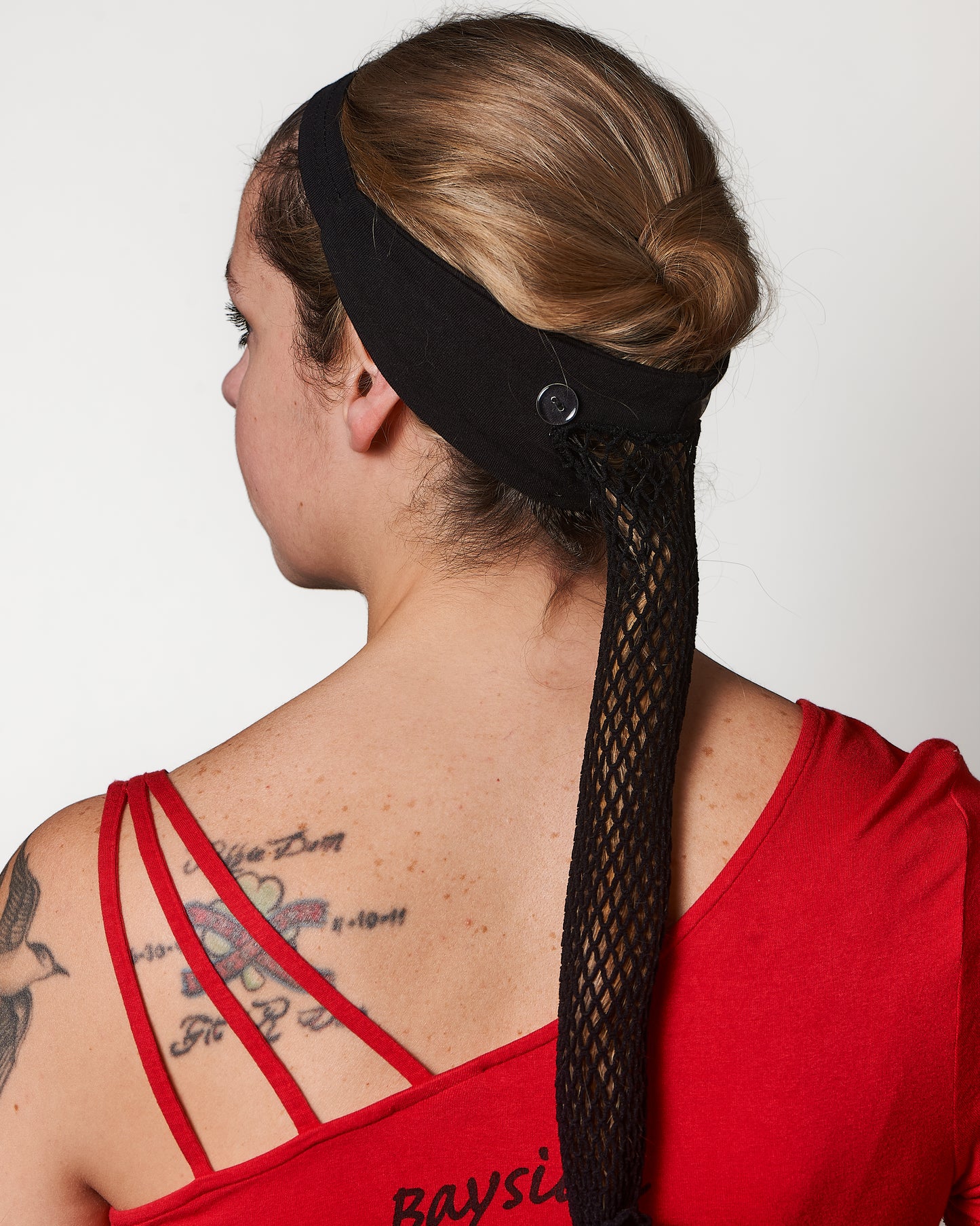 Extra Thin Black Headband, shown from the back, Female model.