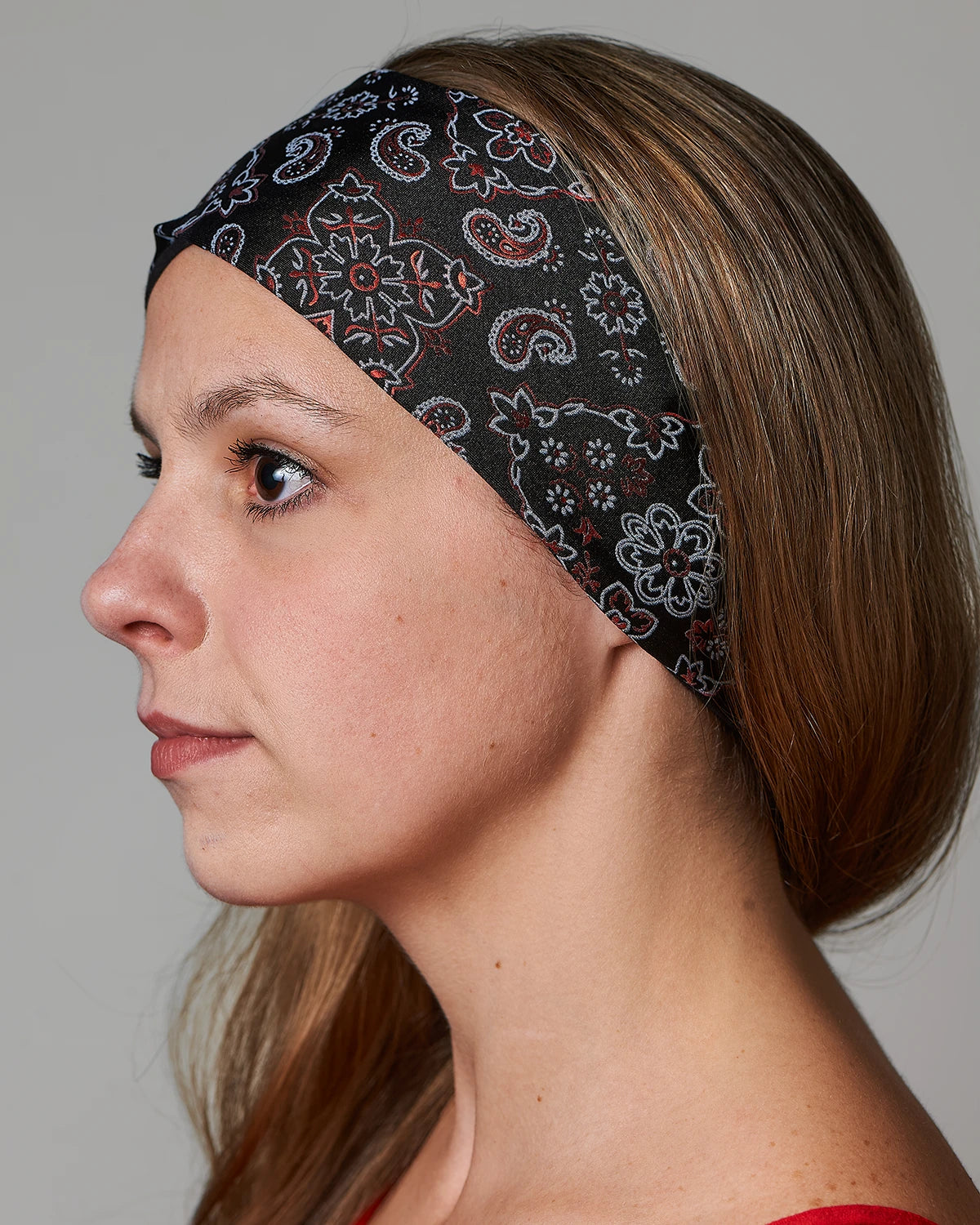 Racy Black and Red Bandana headband with ponytail protector, sidee view (hair out) on female model.