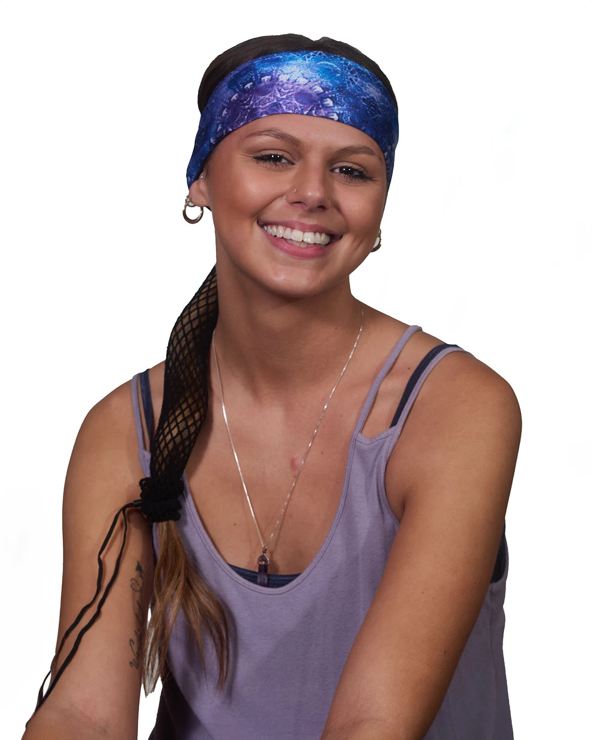 Purple Geometric Tie Dye headband with ponytail protector, front view on female model.
