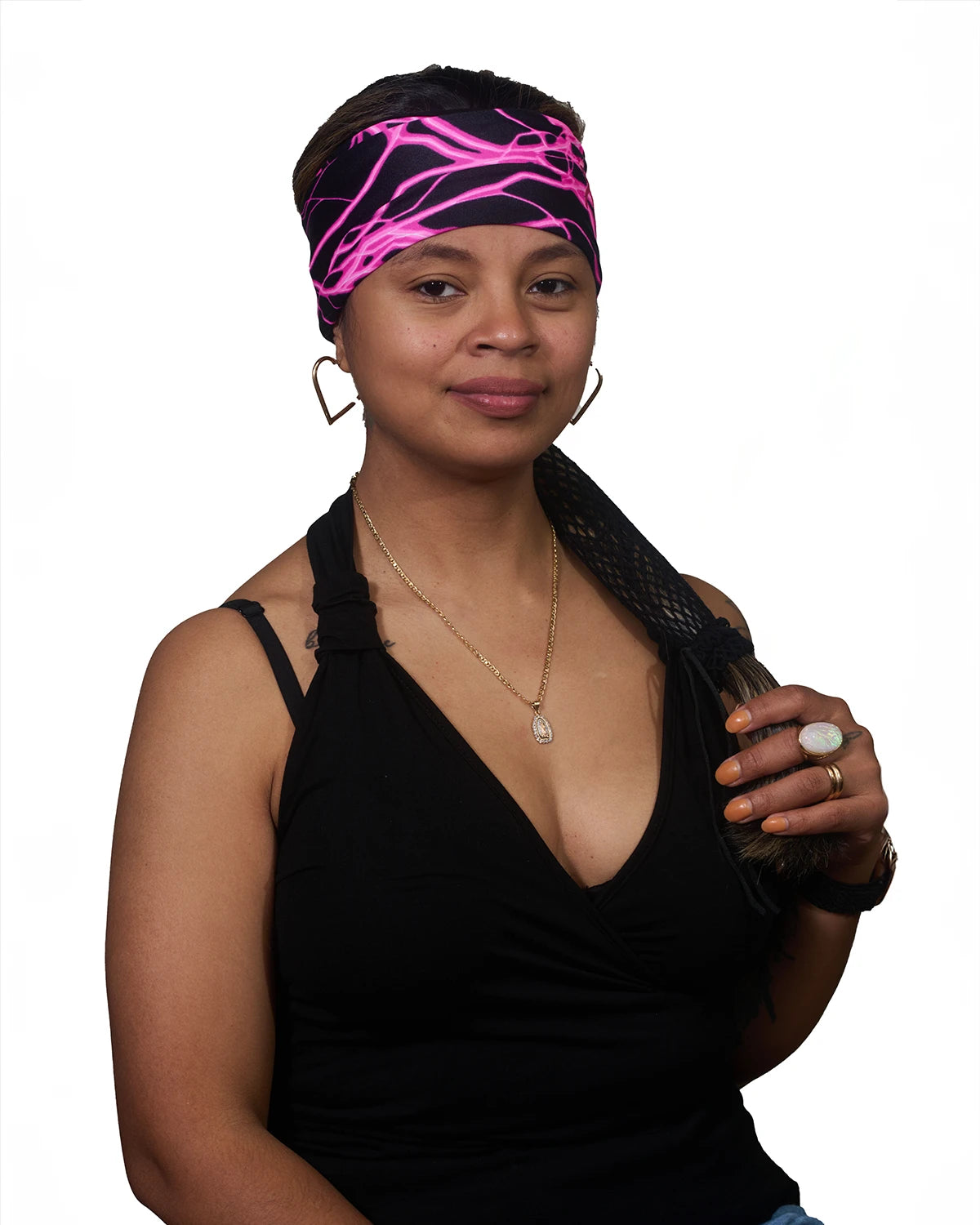 Pink Thunderstorm Cancer Awareness wide headband with ponytail protector, front view on female model.