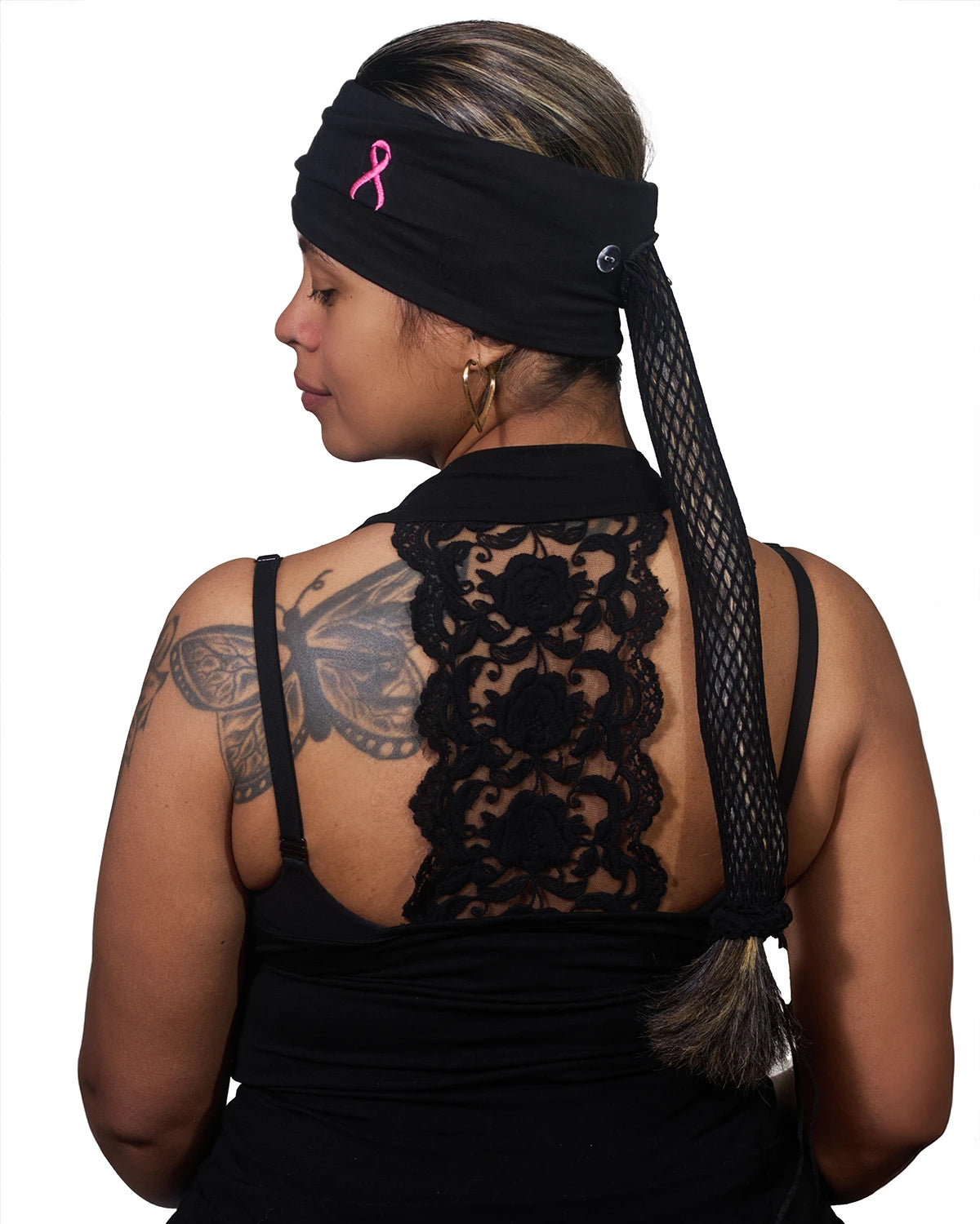 Pink Thunderstorm Cancer Awareness wide headband with ponytail protector, reversed back view on female model.