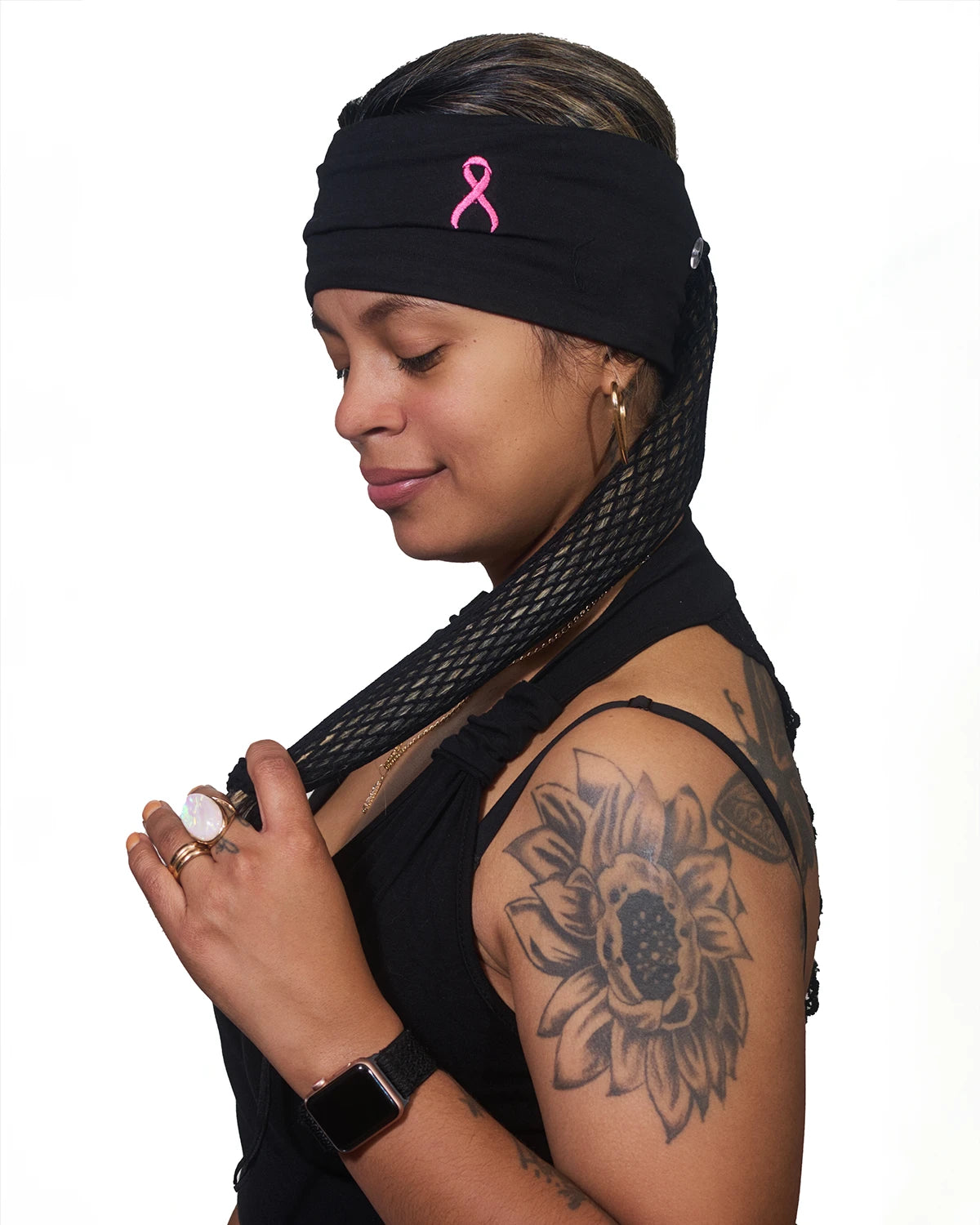 Pink Thunderstorm Cancer Awareness wide headband with ponytail protector, reversed side view on female model.