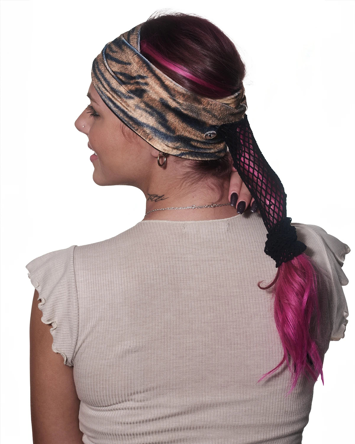 Tiger print wide headband with ponytail protector, back view on female model.