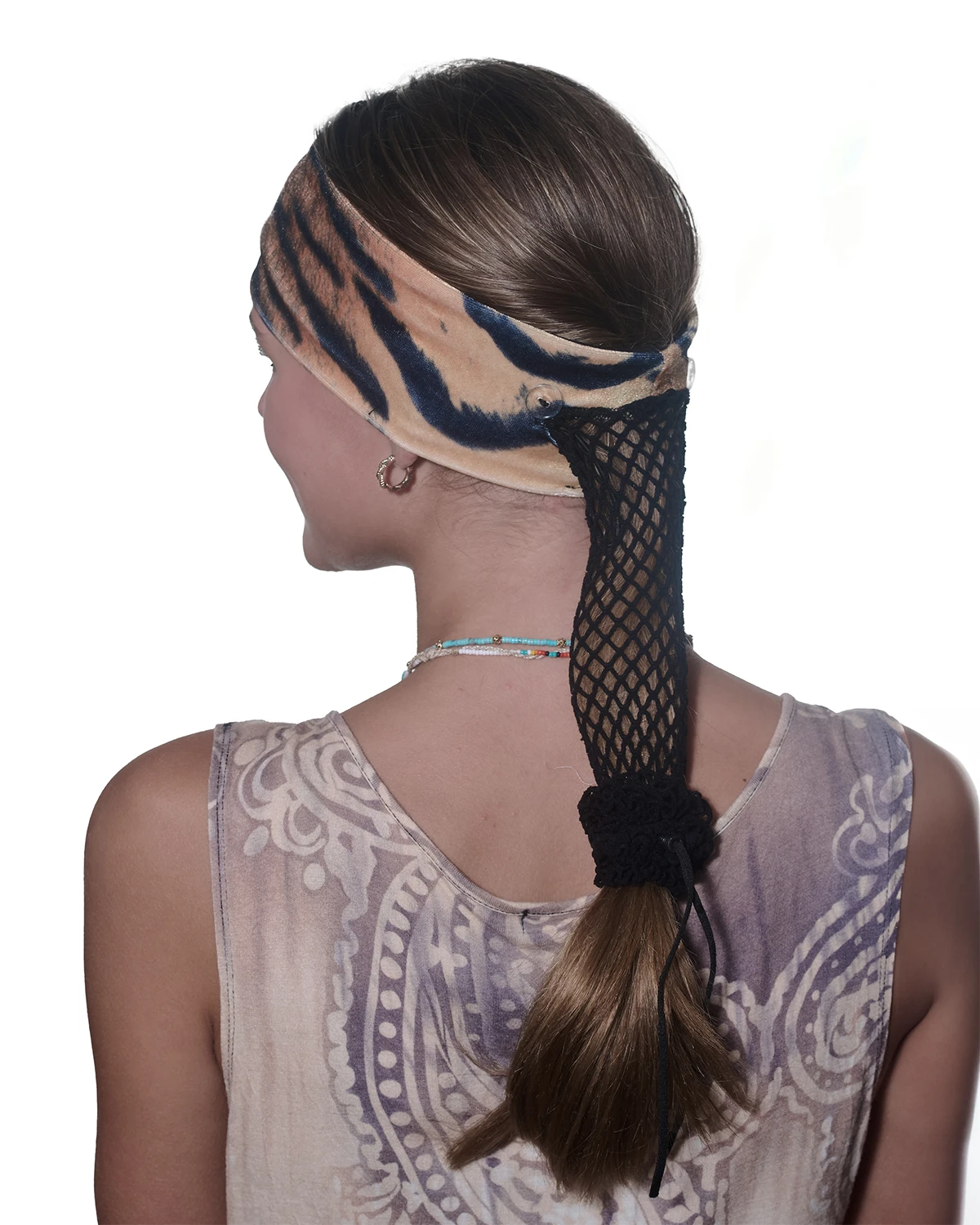 Tiger print headband with ponytail protector, back view on female model.