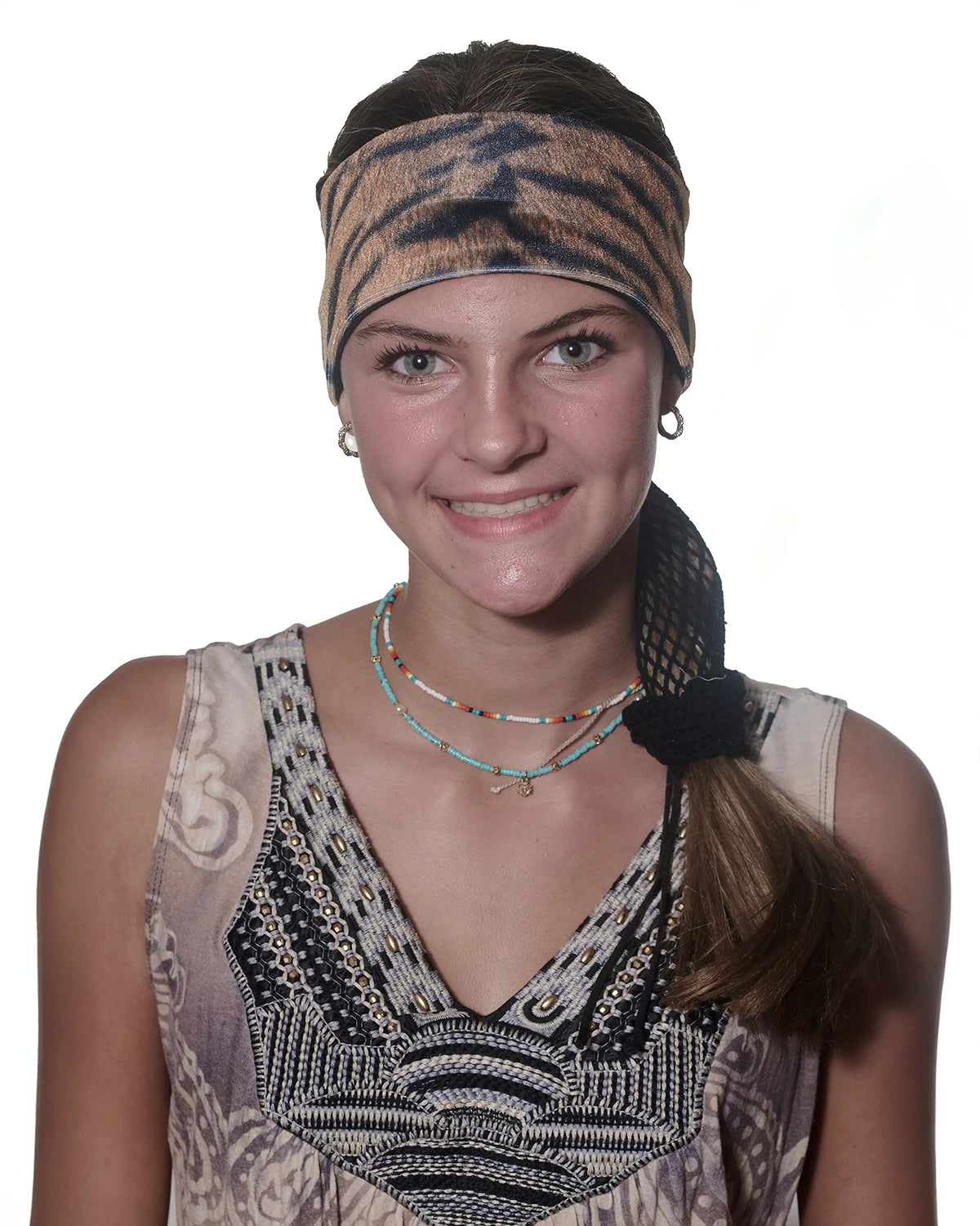 Tiger print headband with ponytail protector, front view on female model.