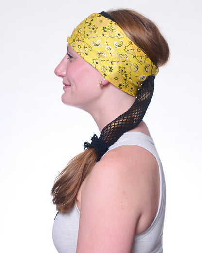 Yellow Brilliance Bandana wide headband with ponytail protector, side view on female model.