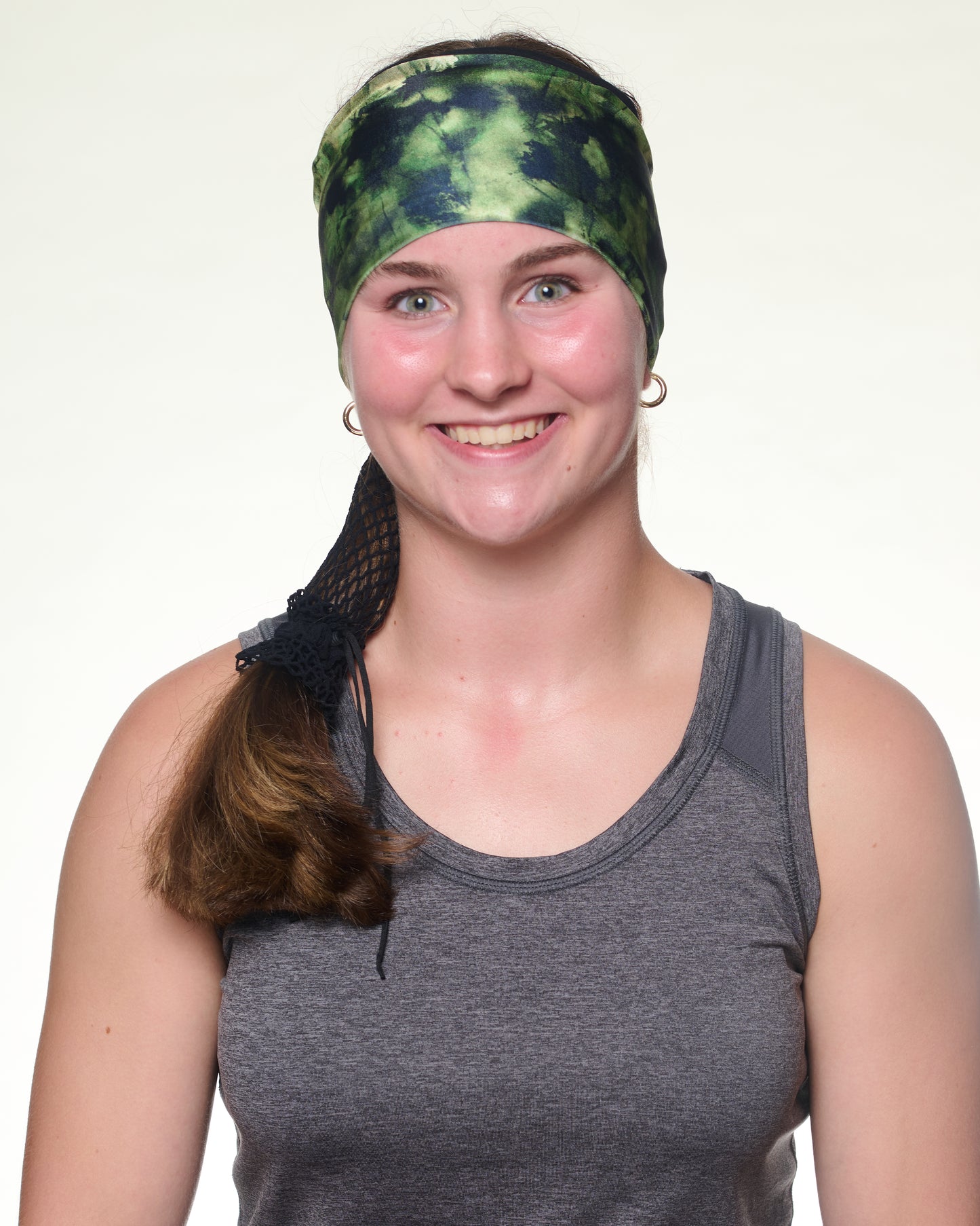 Green Tie Dye Wide headband, front view on female model.