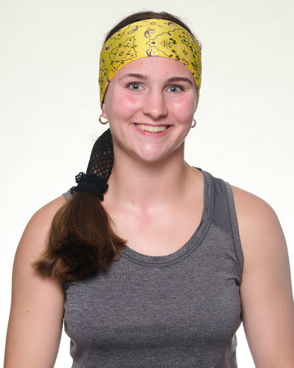 Yellow Brilliance Bandana headband with ponytail protector, front view on female model.