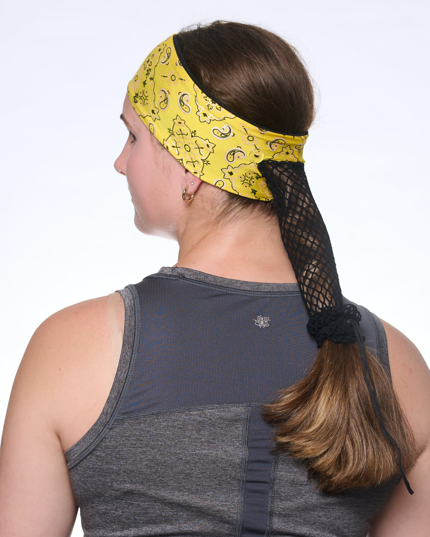 Yellow Brilliance Bandana headband with ponytail protector, back view on female model.