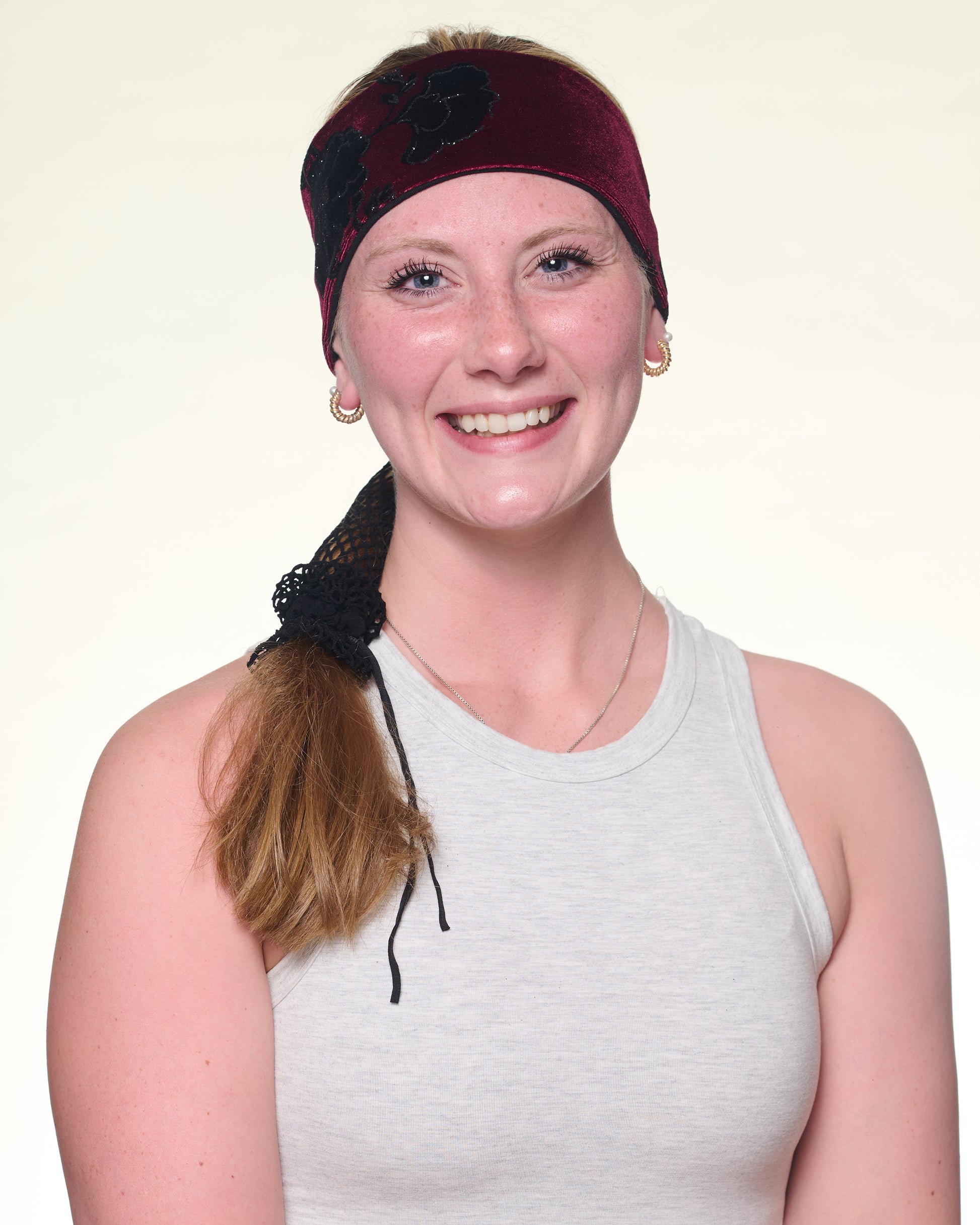 Goth Floral Narrow Headband, front view on female model.