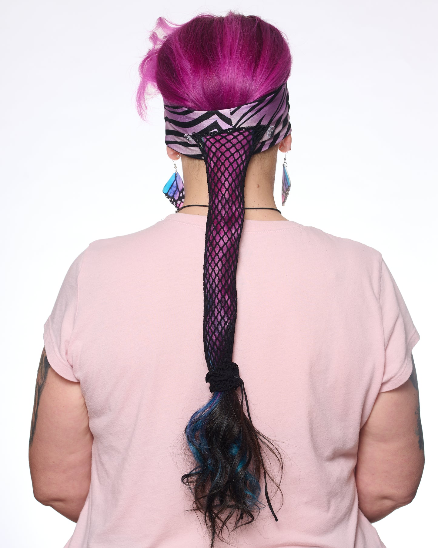 Zebra pattern headband, back view female model.