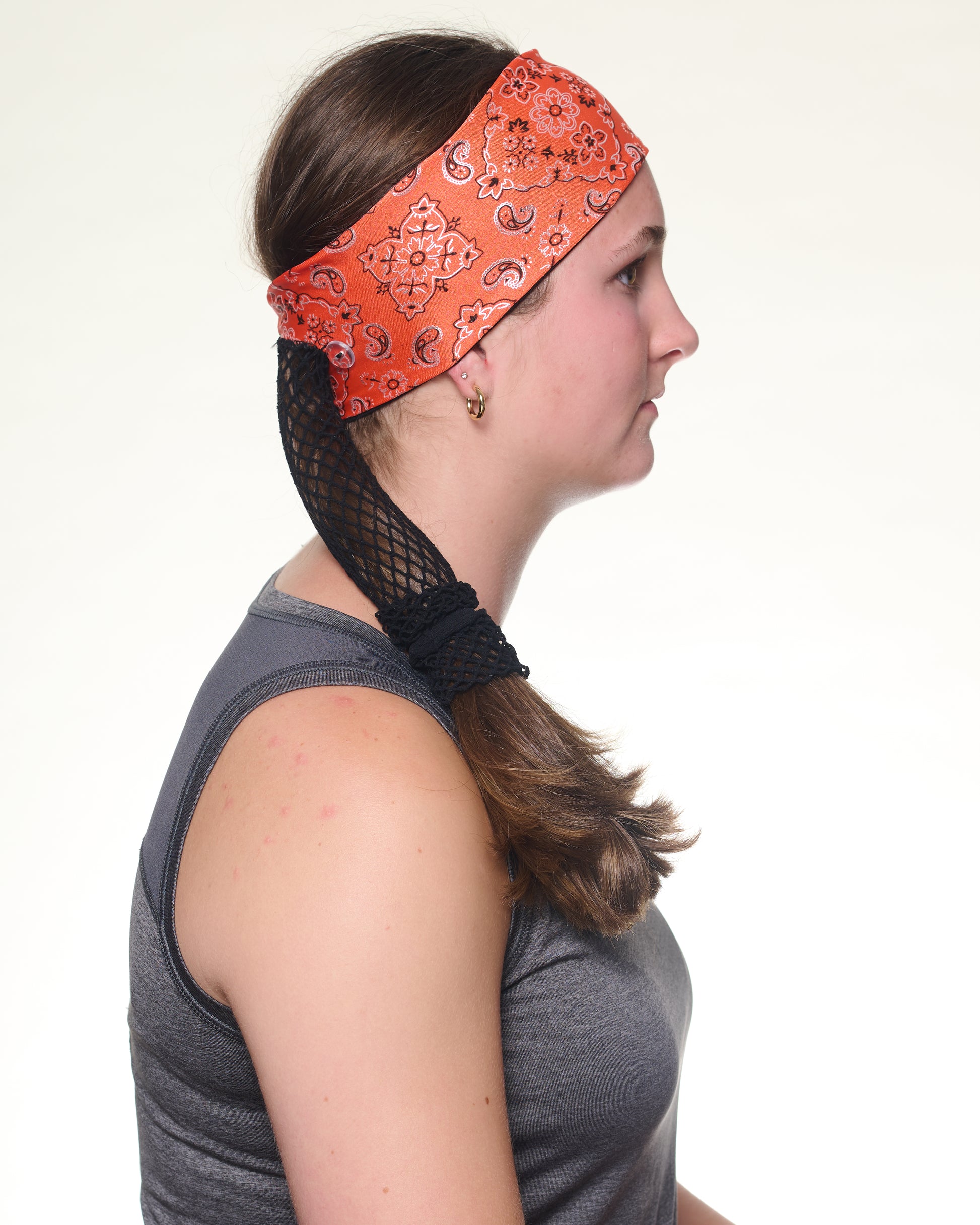 Orange Sunset Bandana Narrow headband, side view on female model.