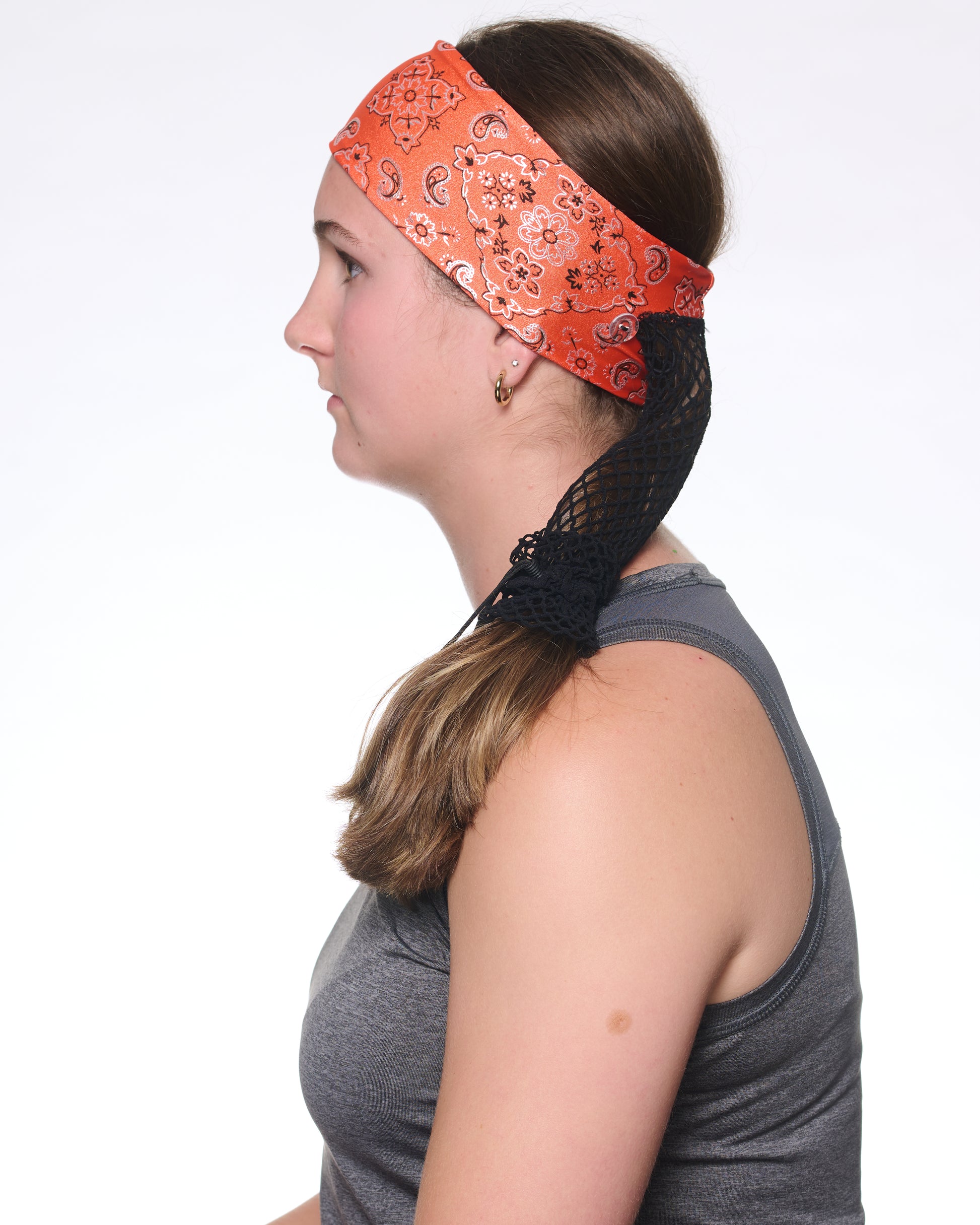 Orange Sunset Bandana Narrow headband, side view on female model.