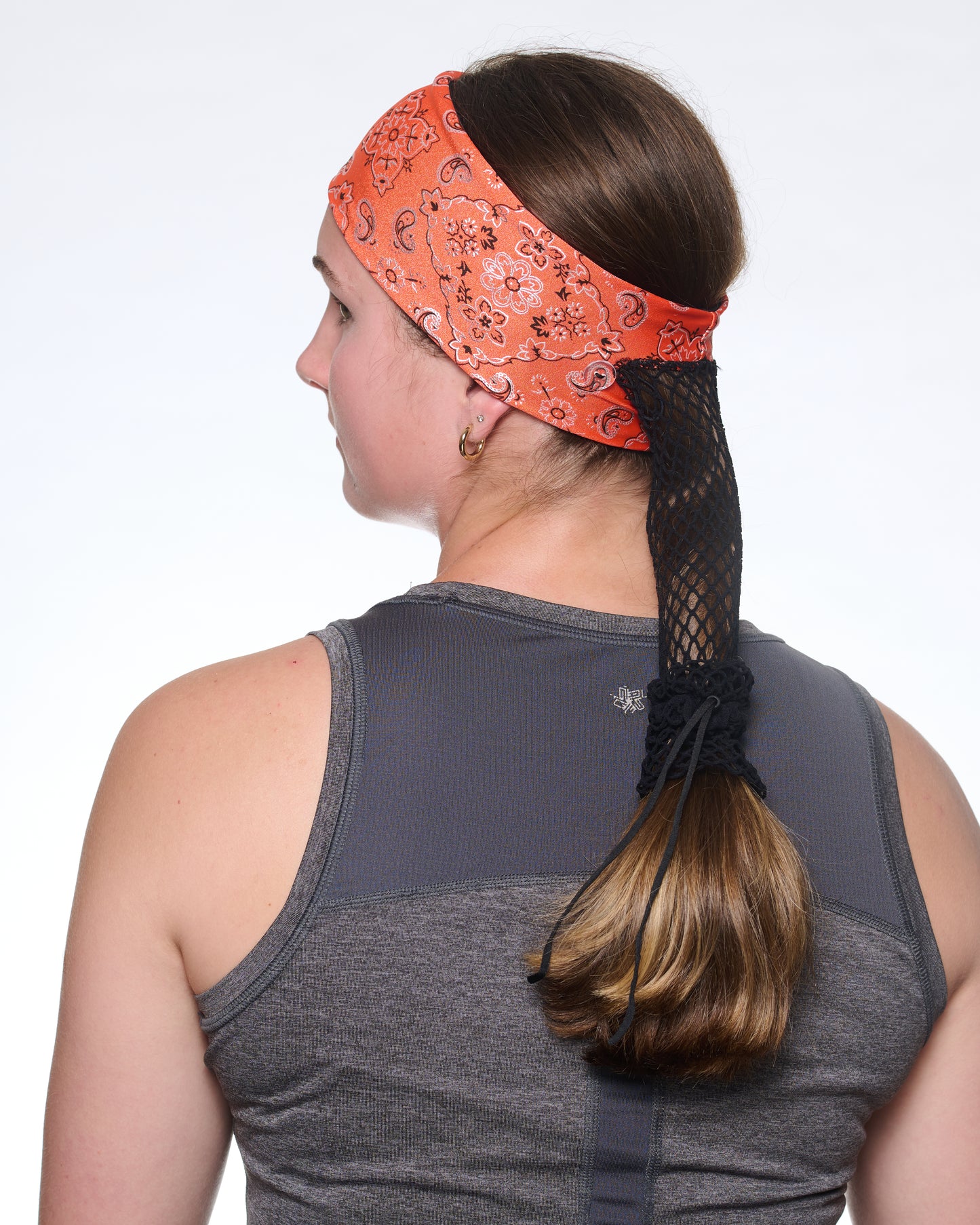 Orange Sunset Bandana Narrow headband, back view on female model.