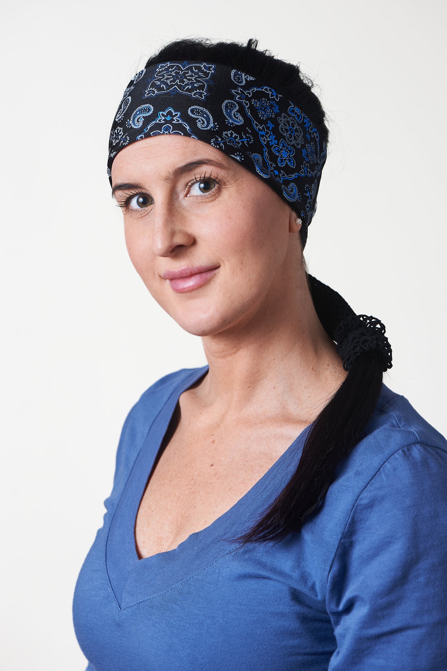 Black and Lazer Blue Bandana, temporary narrow version showing of wide  headband with ponytail protector, side view on female model.