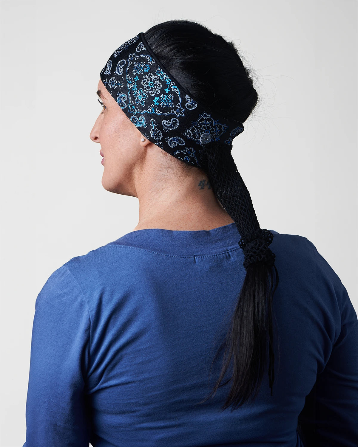 Black and Lazer Blue Bandana headband with ponytail protector, back view on female model.