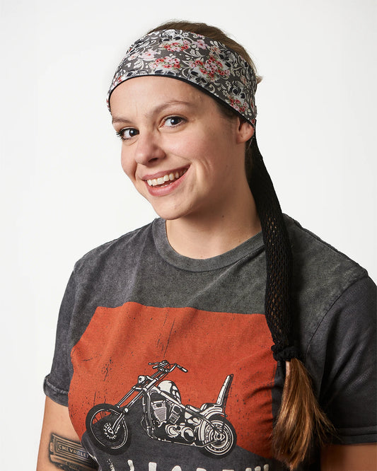 Gray Floral Mystical Skulls headband with ponytail protector, front view on female model.