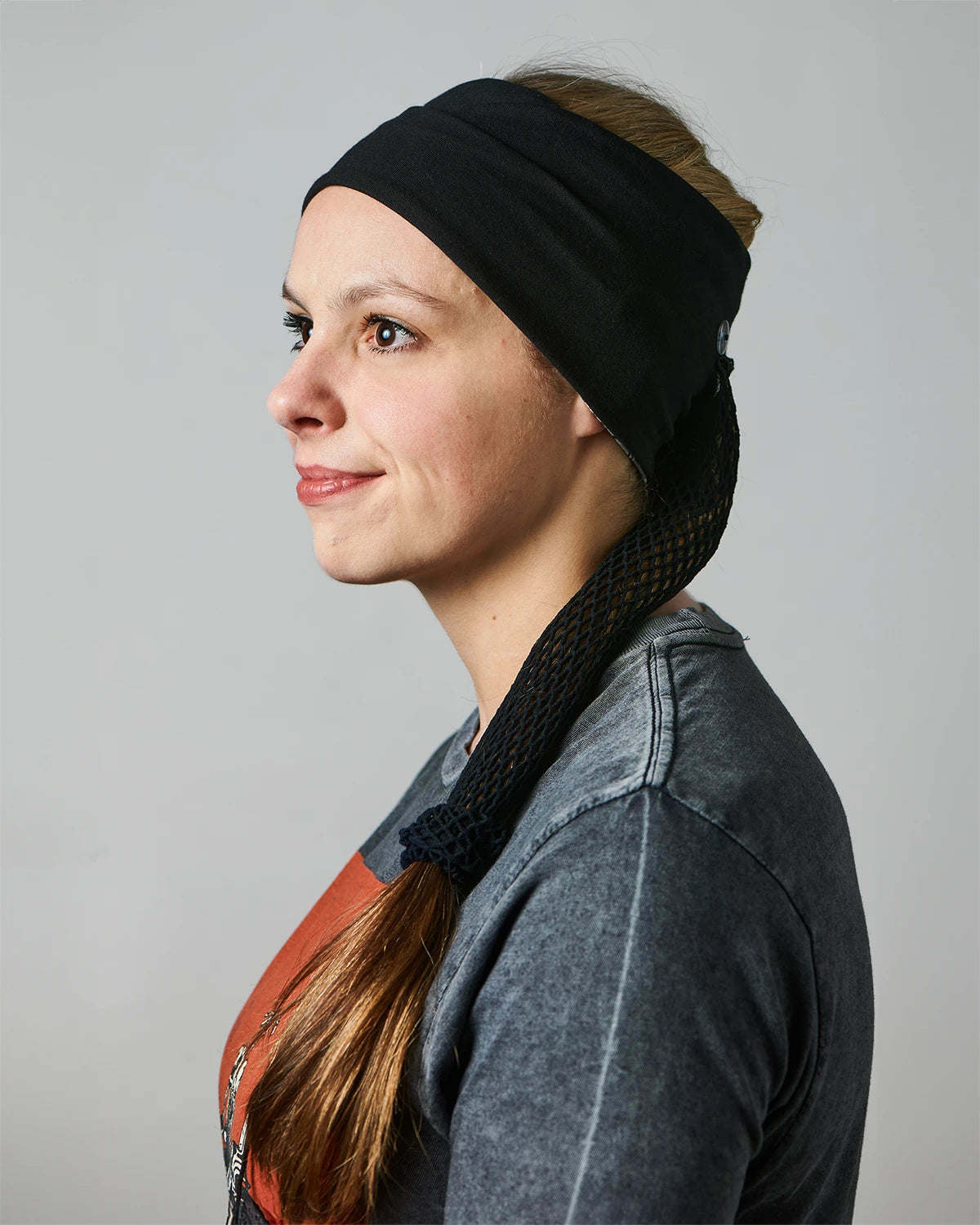 Gray Classic Tie-Dye wide headband with ponytail protector, reverse side view female model.