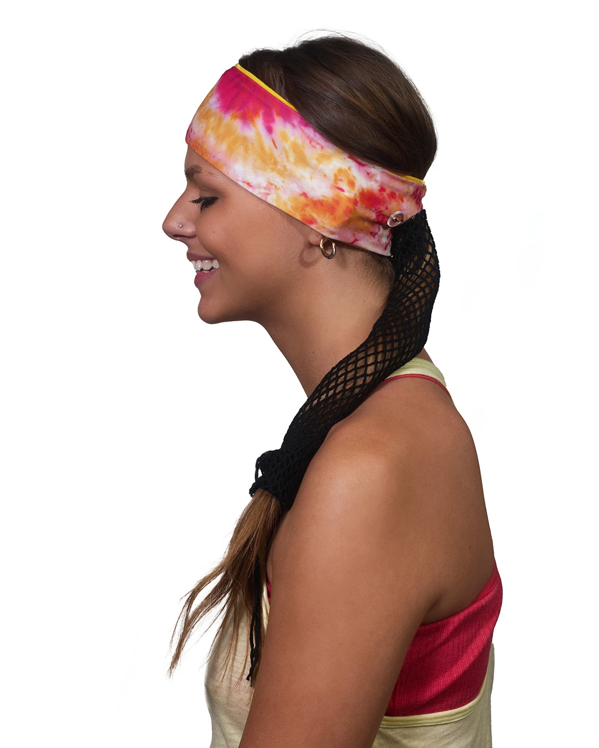 Orange-Yellow Vibrance Tie-Dye headband with ponytail protector, side view on female model.