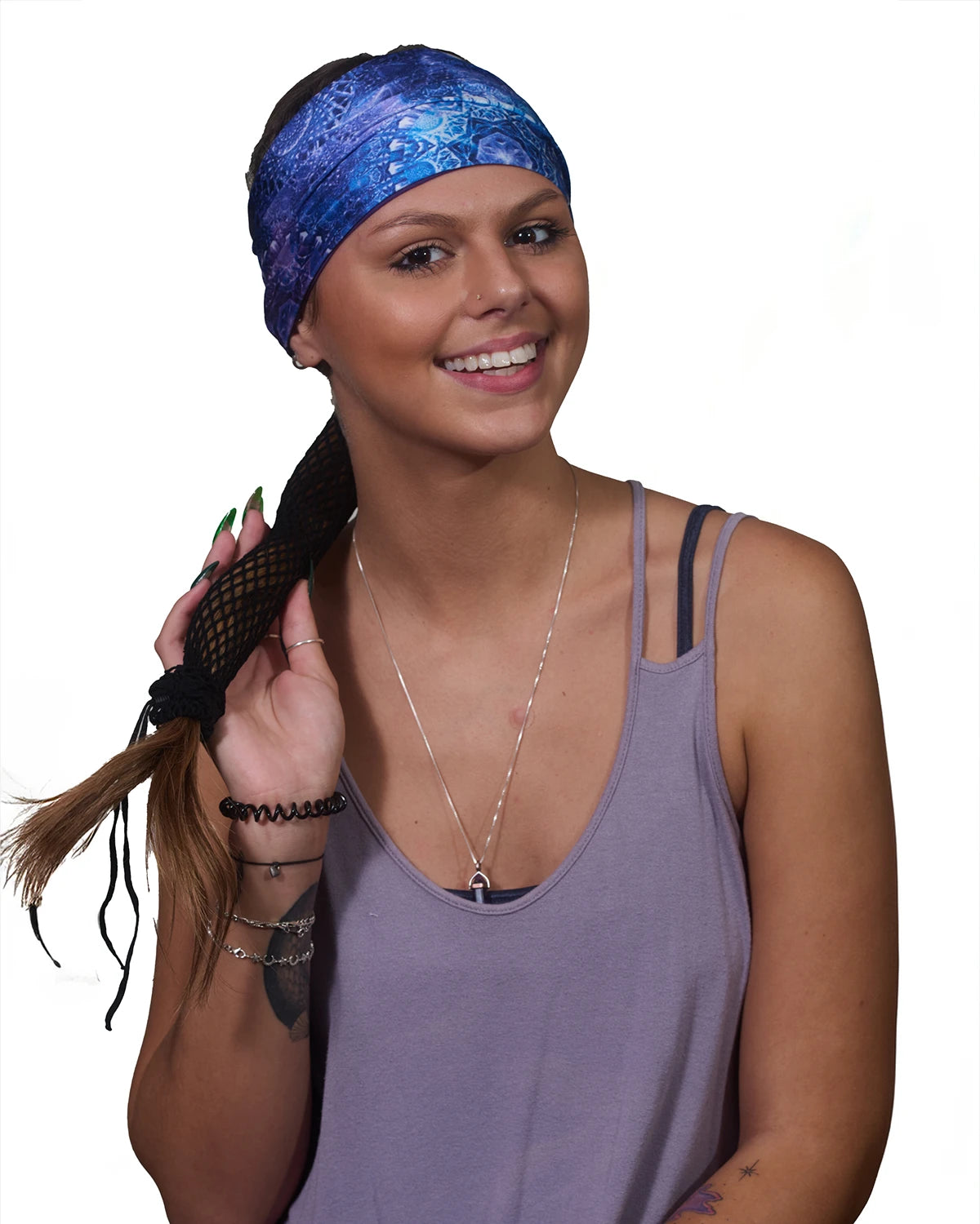 Purple Geometric Tie Dye wide headband with ponytail protector, front view on female model.