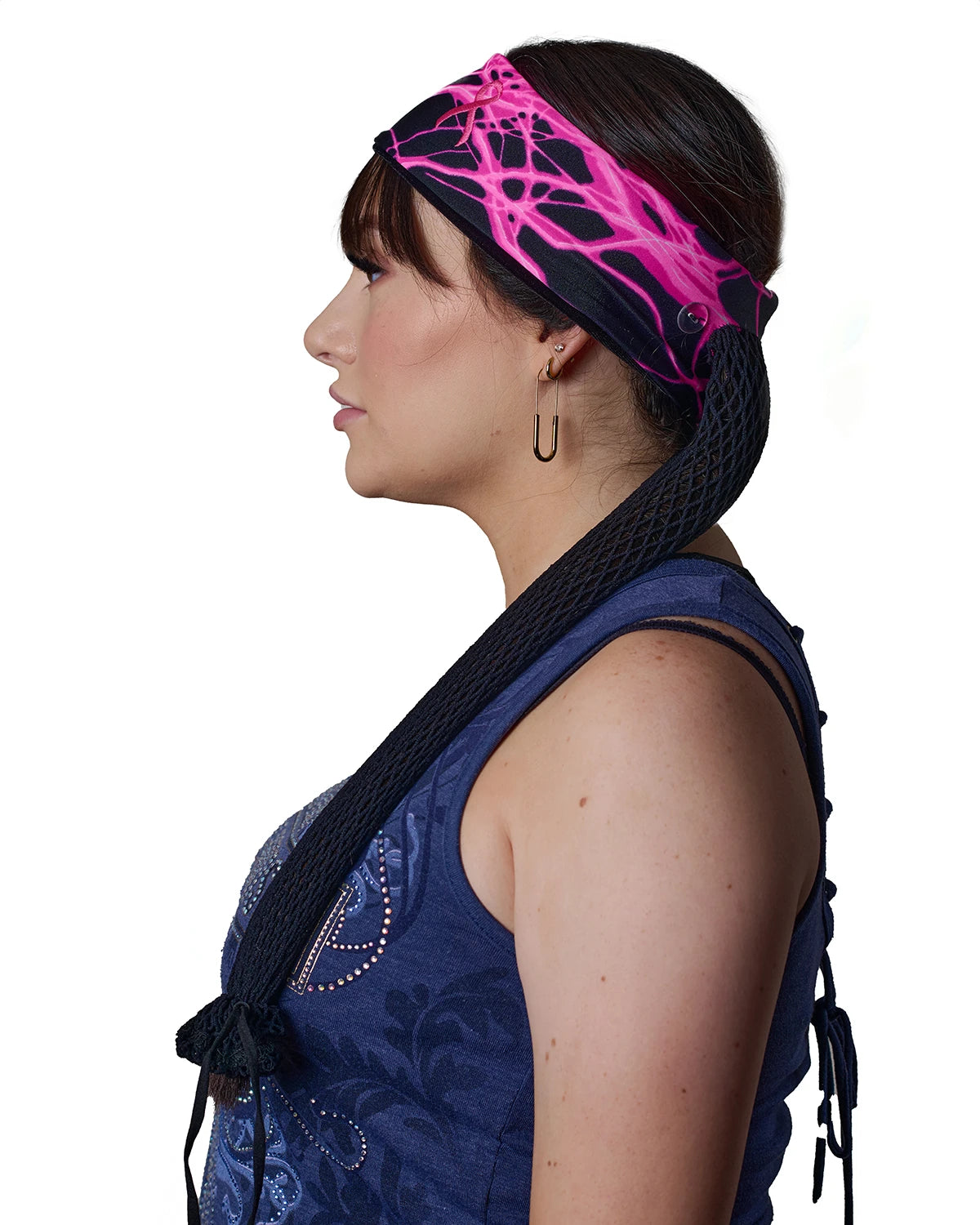 Pink Thunderstorm Cancer Awareness headband with ponytail protector, side view on female model.