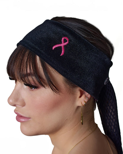 Pink Thunderstorm Cancer Awareness headband with ponytail protector, reverse side view on female model.