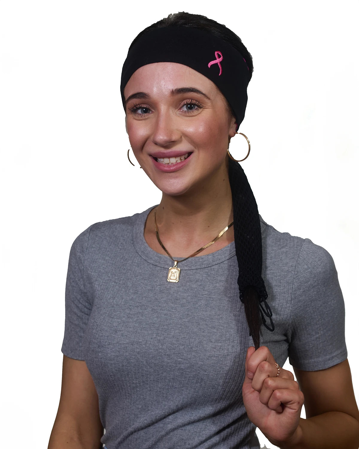 Pink Thunderstorm Cancer Awareness headband with ponytail protector, reverse front view on female model.